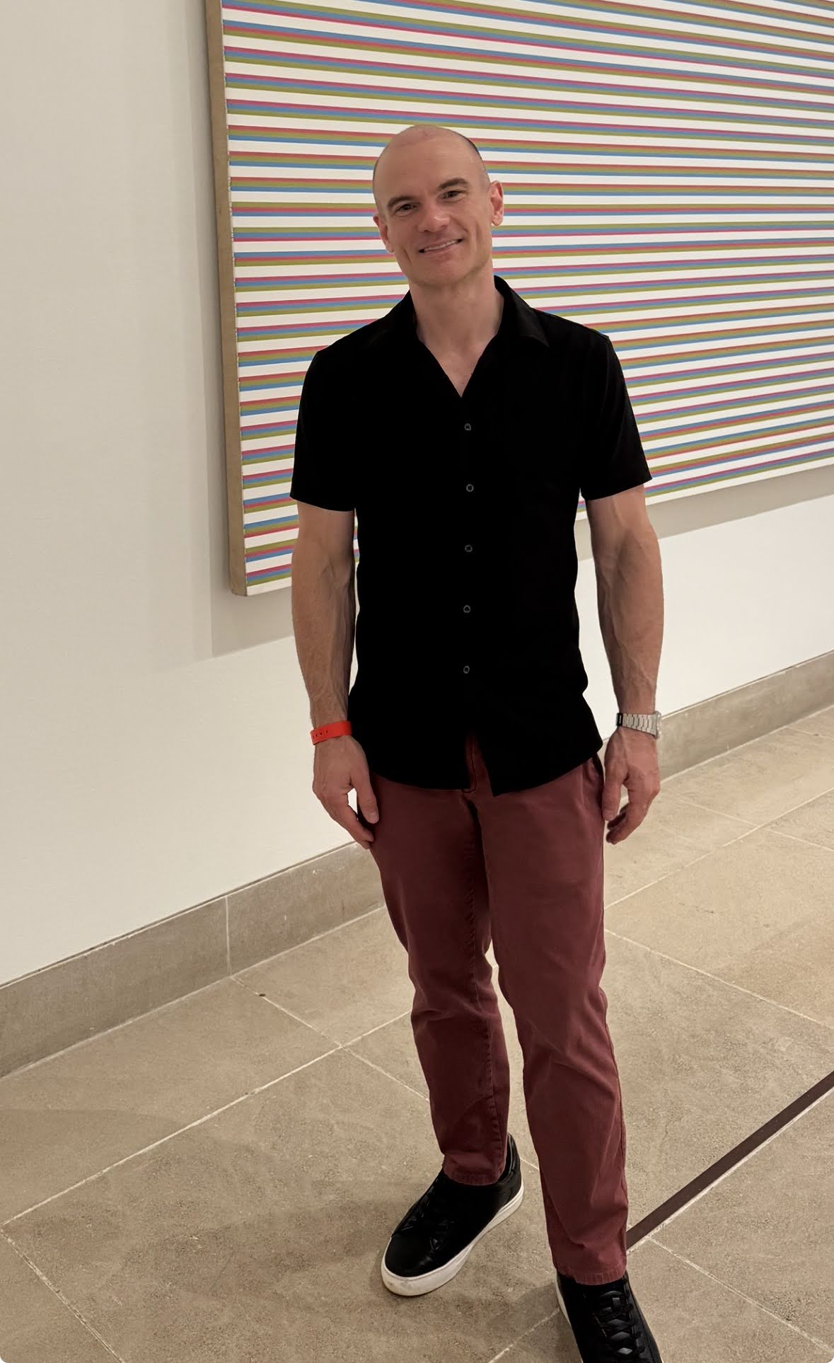 Portrait of Clint Nail in an art gallery